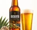 Botella de cerveza DESIERTO Lager 5,1% con etiqueta negra, marca almeriense Bodegas del Desierto